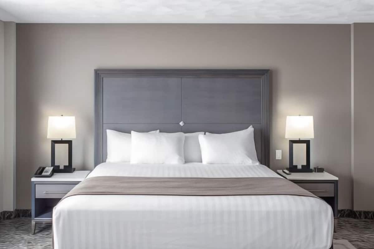 Desk, laptop workspace, blackout curtains, iron/ironing board