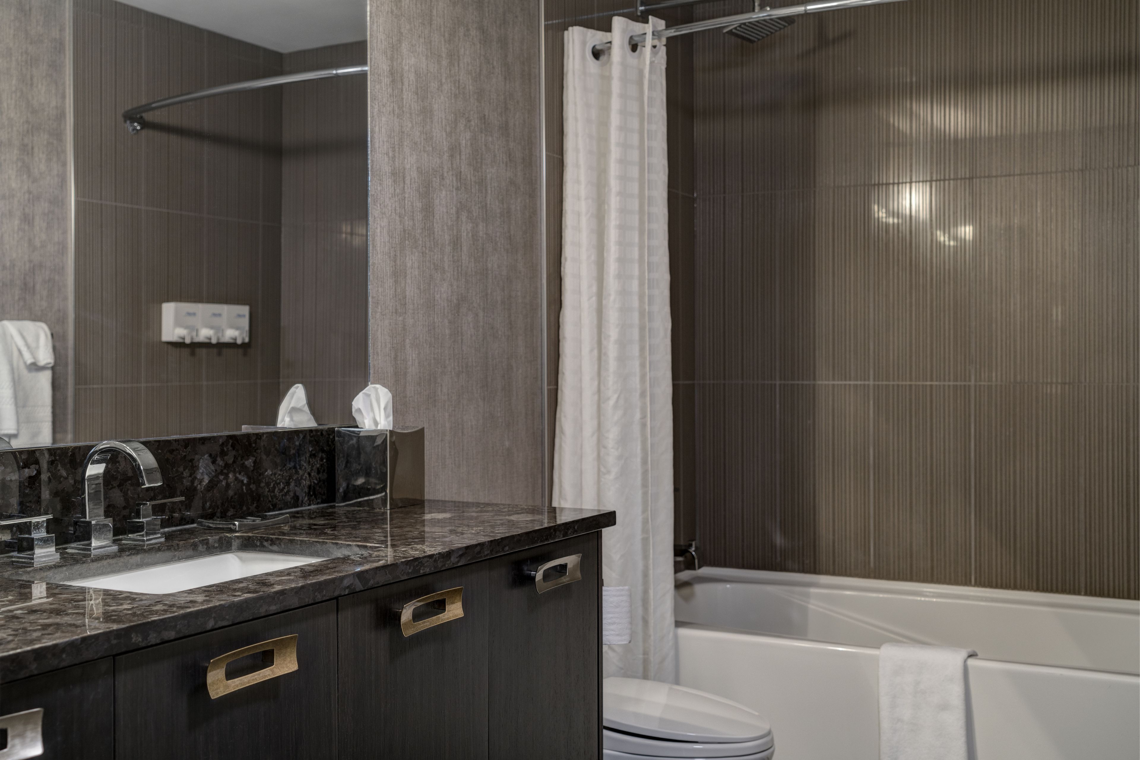 combined shower/bathtub, deep-soaking bathtub, rainfall showerhead