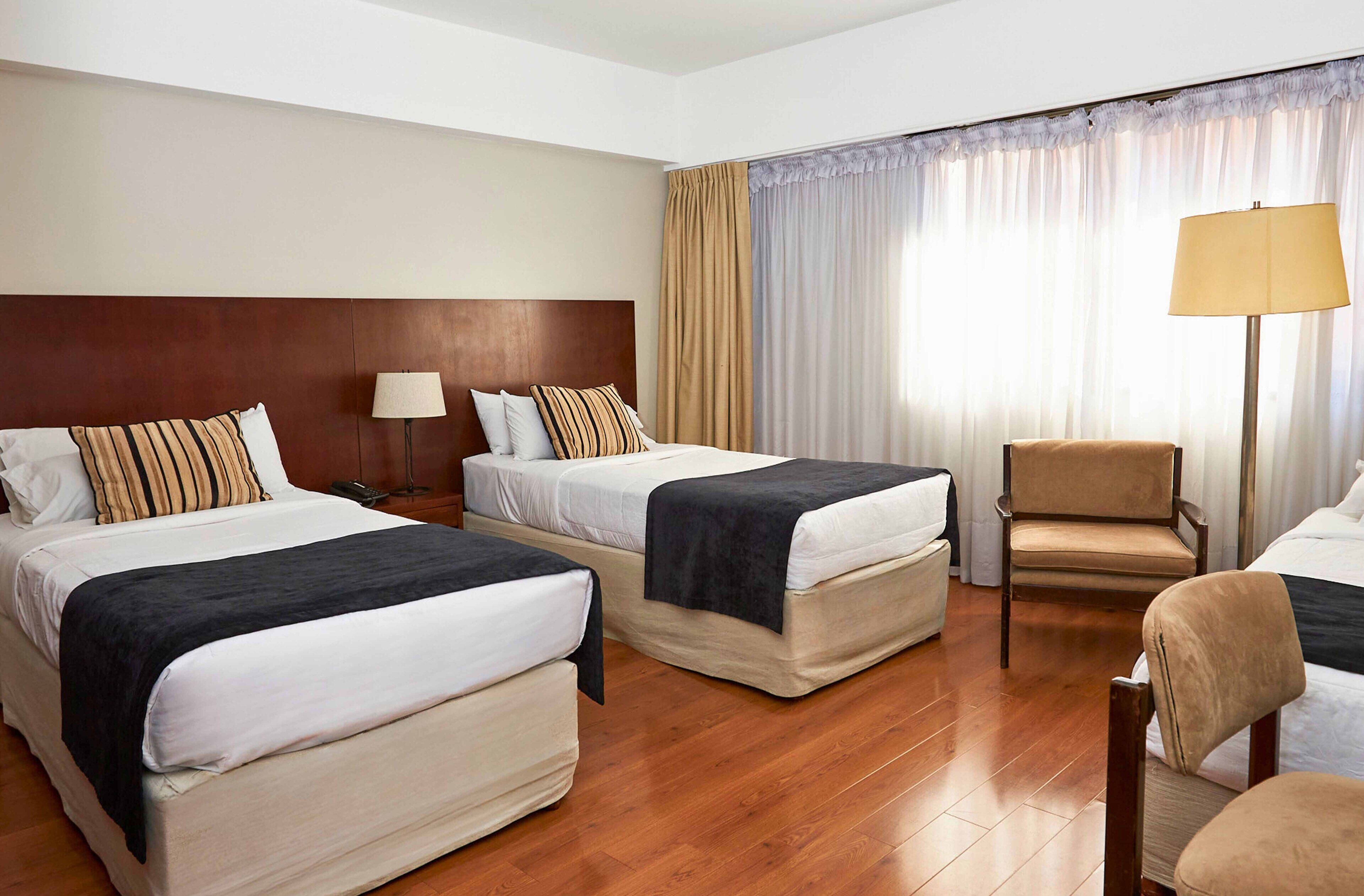 standard triple room | premium bedding, down duvets, pillow-top beds, in-room safe