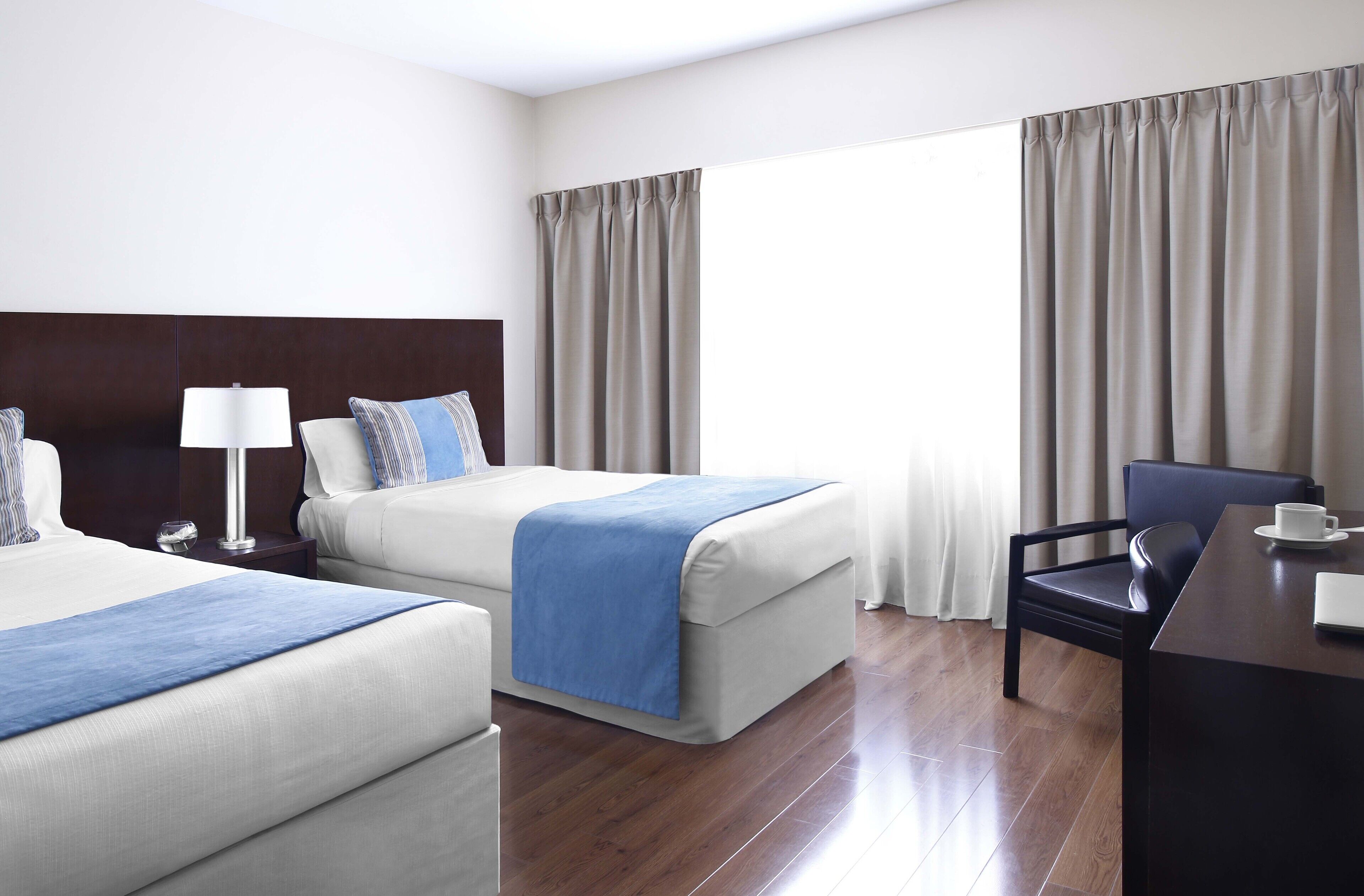 standard double or twin room | premium bedding, down duvets, pillow-top beds, in-room safe