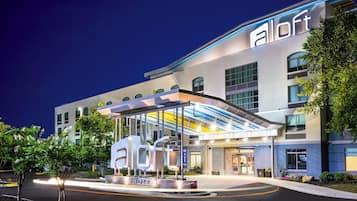 Experience the contemporary style of this hotel, featuring a flat roof and unique windows.