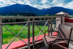 Enjoy a serene view of the golf course and surrounding mountains from this balcony.