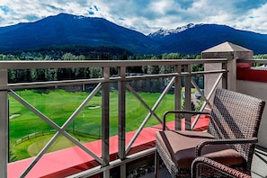 Enjoy a serene view of the golf course and surrounding mountains from this balcony.