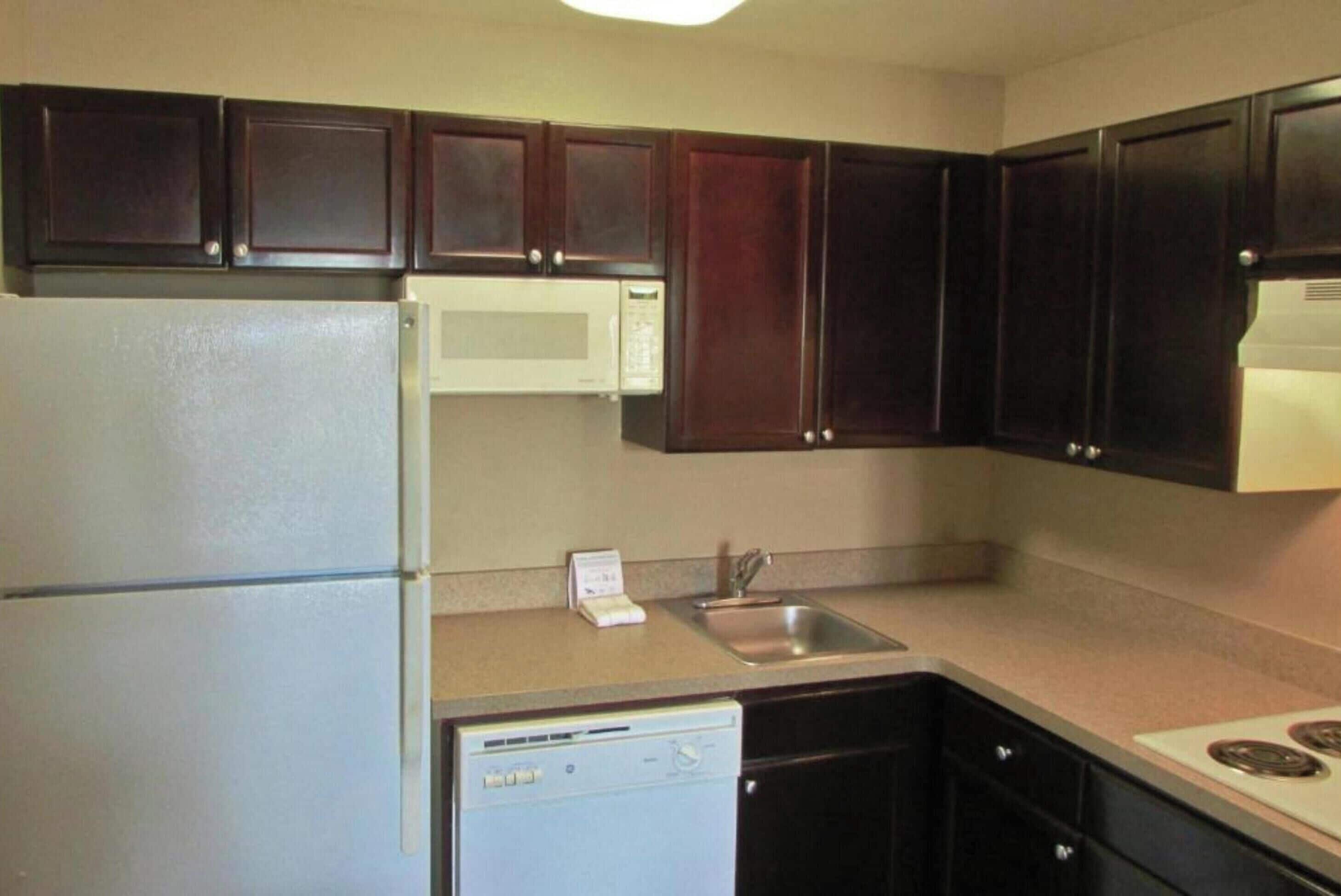 Fridge, microwave, stovetop, cookware/dishes/utensils