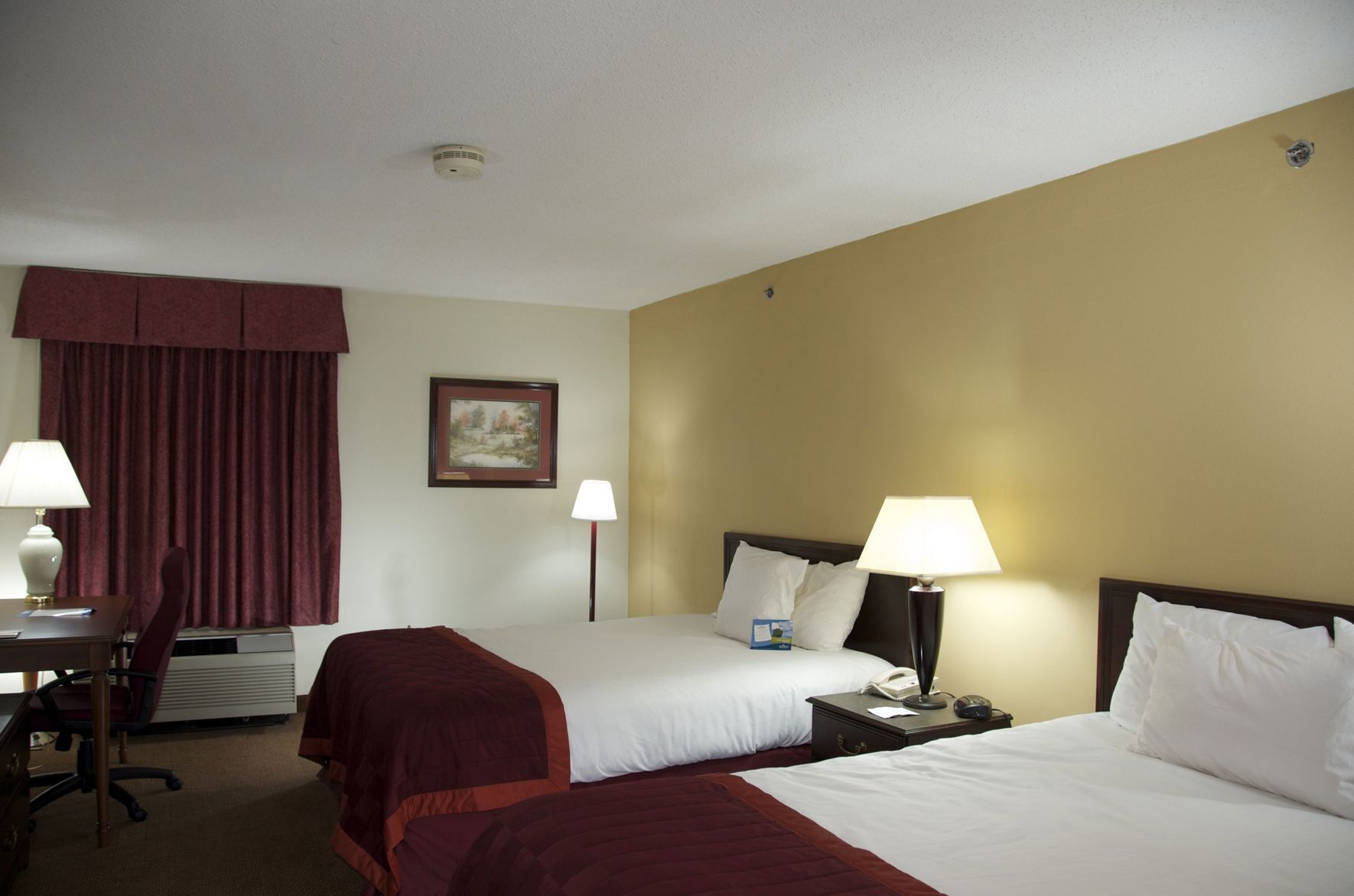 Desk, laptop workspace, iron/ironing board, free cribs/infant beds