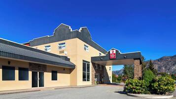 A Best Western hotel with a modern design, featuring a large entrance and a parking area.