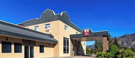 A Best Western hotel with a modern design, featuring a large entrance and a parking area.
