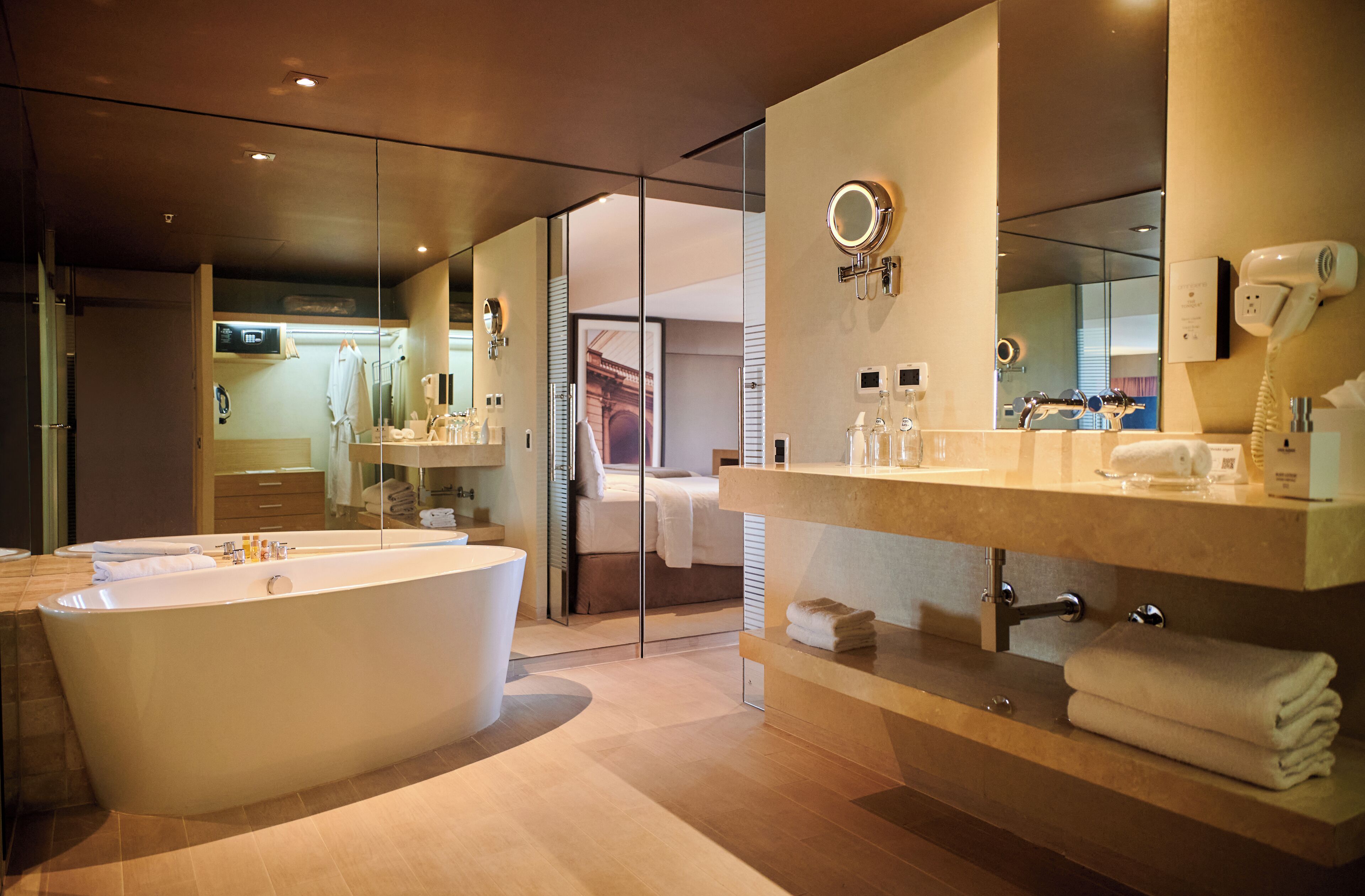 junior suite, multiple beds, city view | bathroom | eco-friendly toiletries, hair dryer, bathrobes, towels