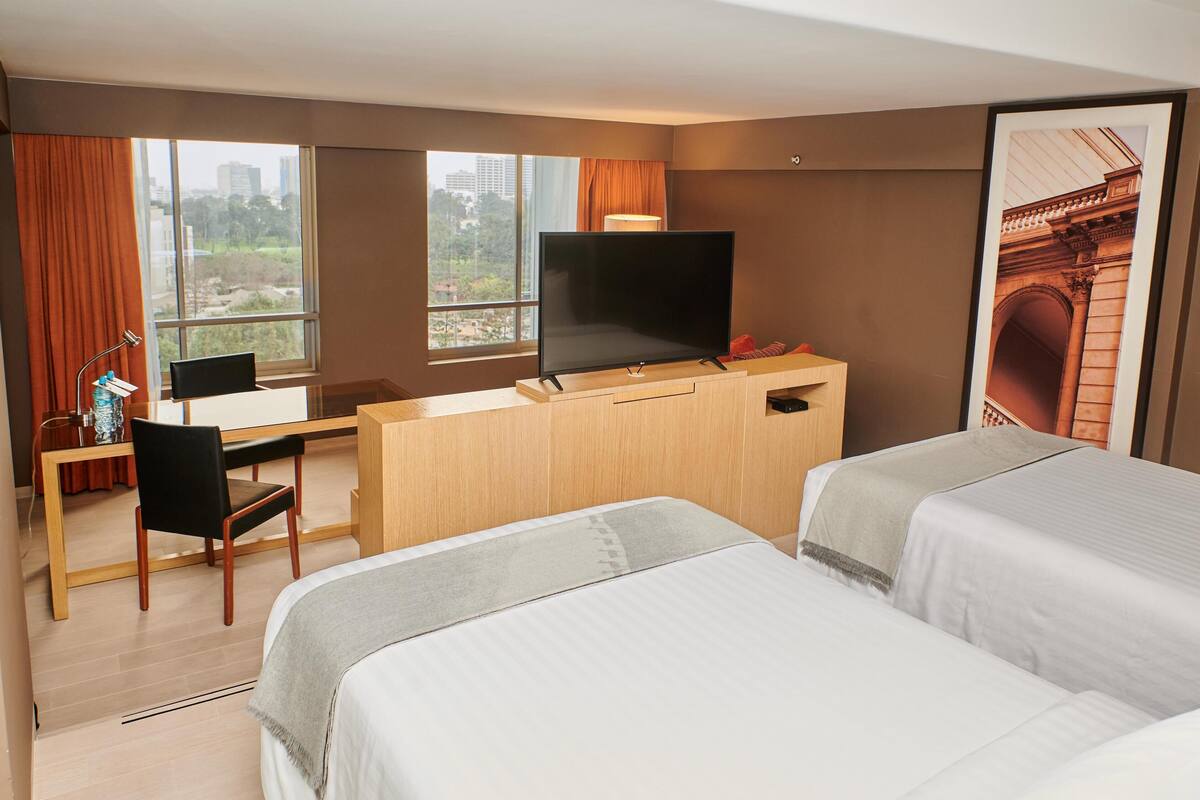 Premium bedding, down comforters, pillowtop beds, minibar