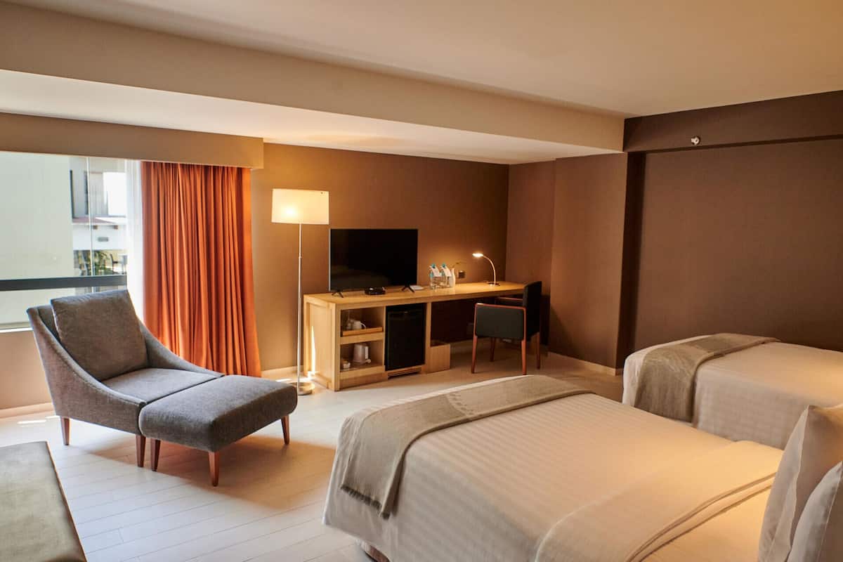 Premium bedding, down comforters, pillowtop beds, minibar