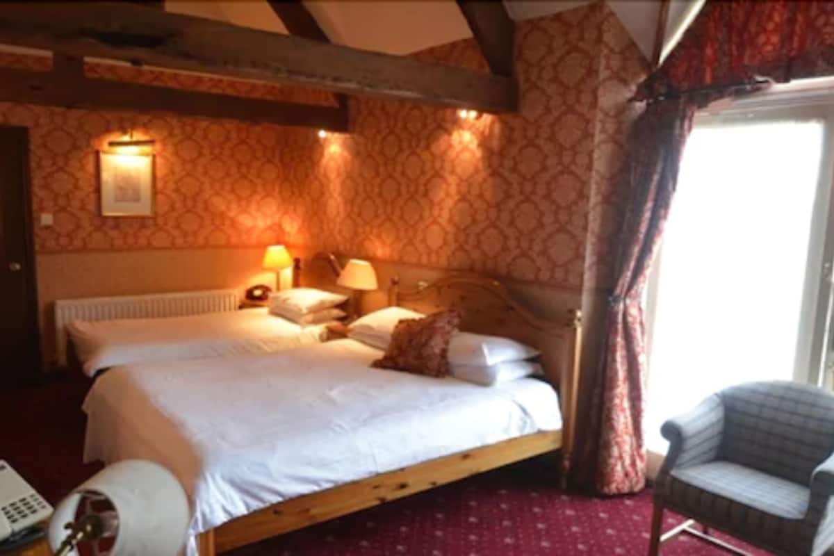 family room | individually decorated, desk, iron/ironing board, free cots/infant beds