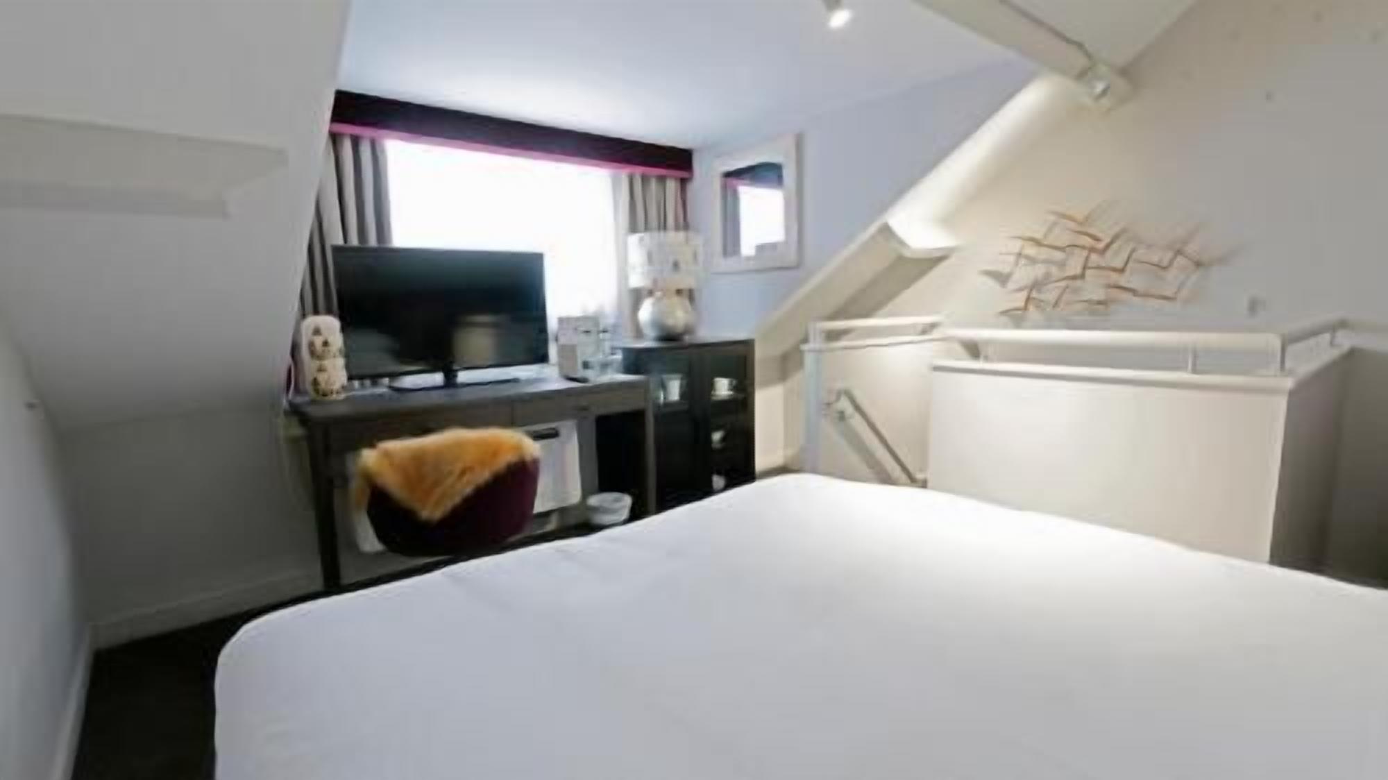 In-room safe, individually decorated, desk, blackout curtains