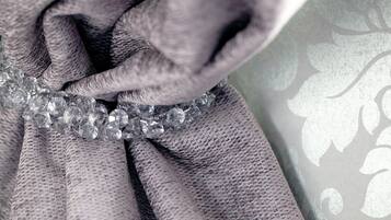A close-up of a textured fabric with a decorative element.