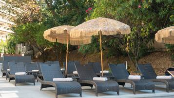 Outdoor pool, open 9:30 AM to 8:30 PM, pool umbrellas, pool loungers