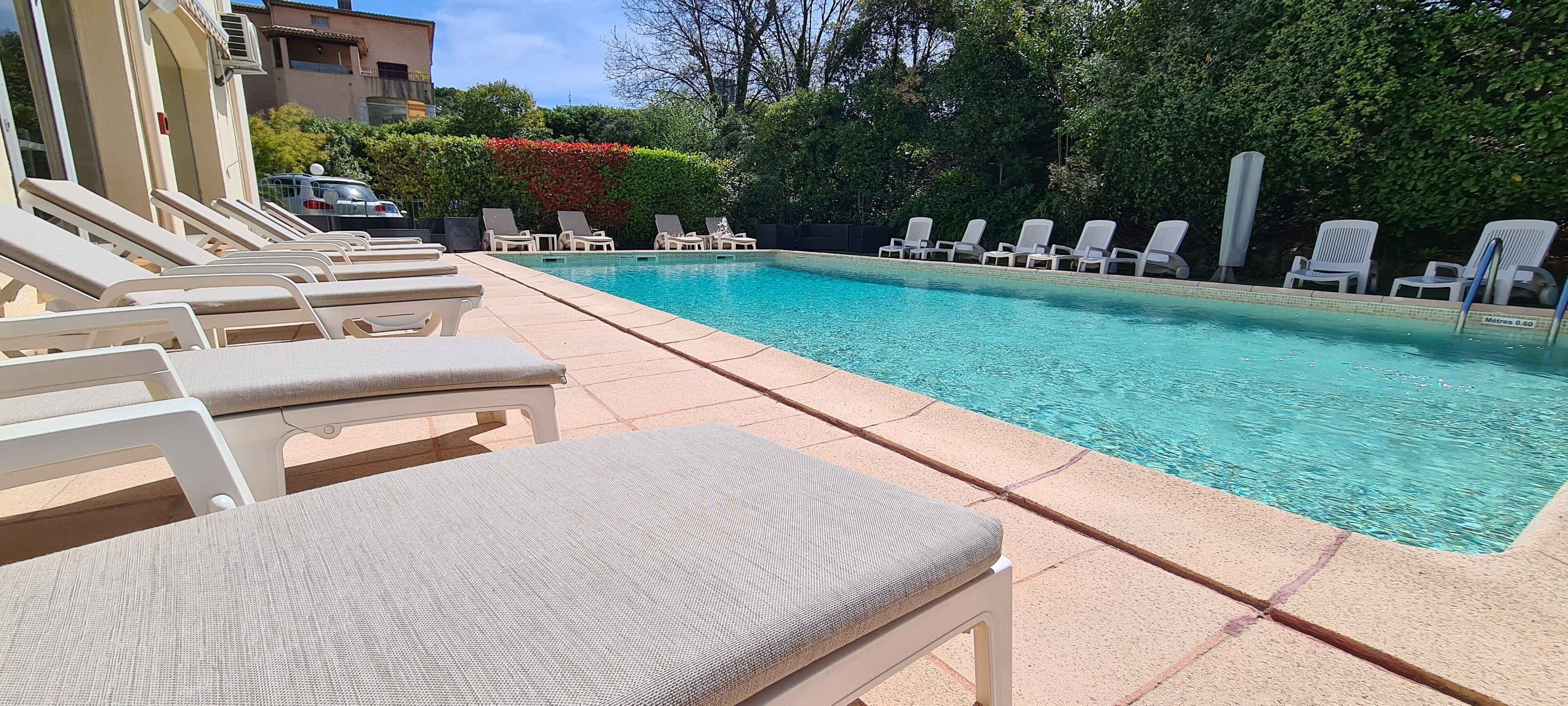 outdoor pool, open 7:30 am to 9 pm, pool umbrellas, pool loungers