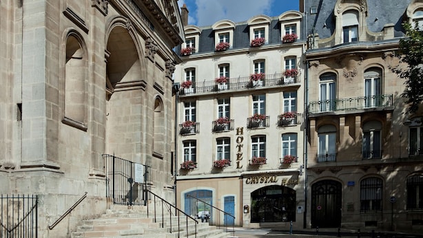 A historic building with a central entrance, multiple balconies with flower boxes, and a sign reading "HOTEL CRYSTAL." - Best Western Plus Crystal, Hotel & Spa (Nancy)