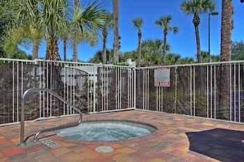 Outdoor pool, sun loungers at The Adventure Hotel by the parks