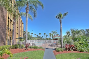 Outdoor pool, sun loungers at The Adventure Hotel by the parks