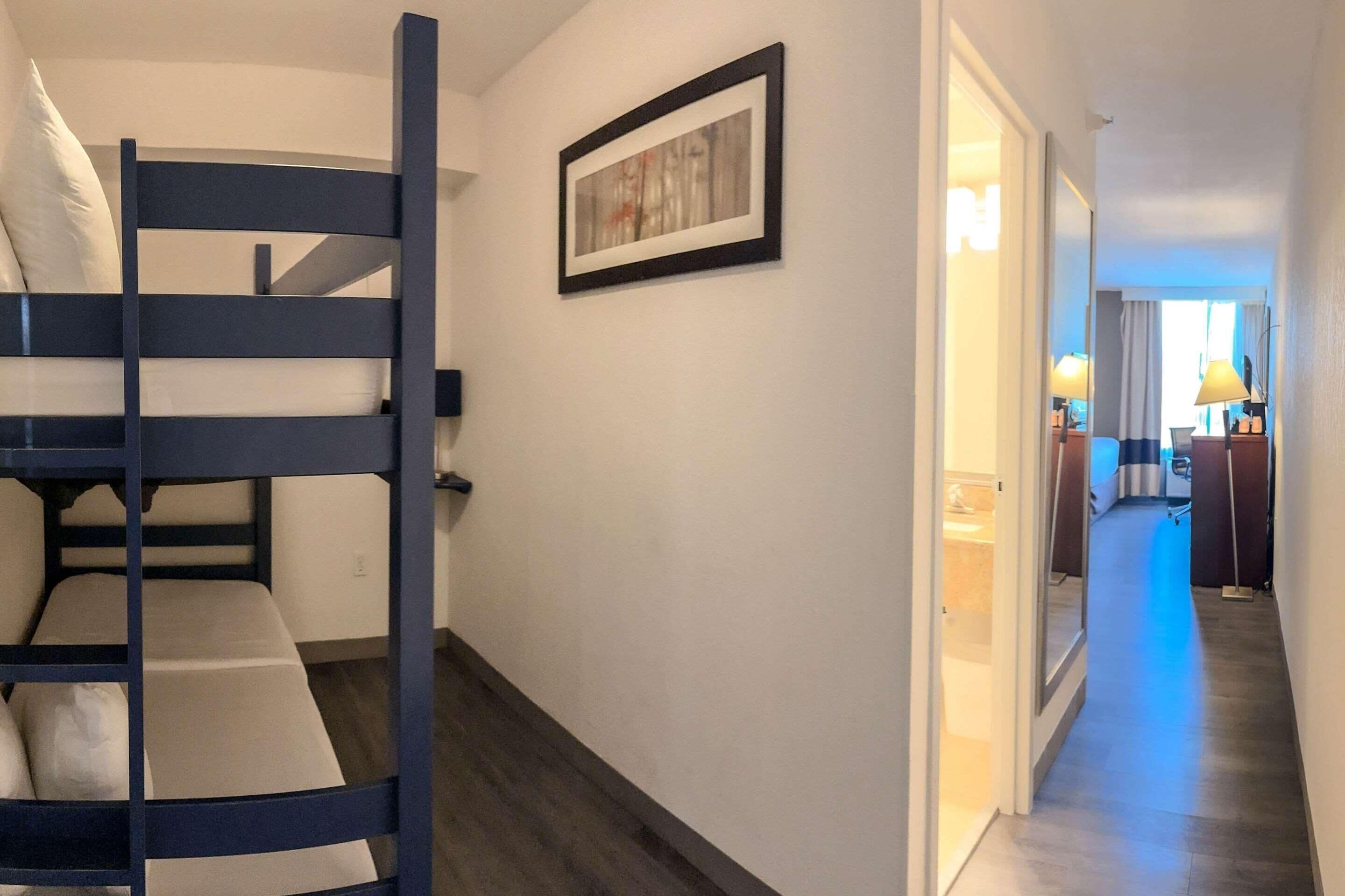 Family Room, 2 Bedrooms | Pillowtop beds, in-room safe, desk, laptop workspace