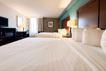 Pillowtop beds, in-room safe, desk, laptop workspace at The Adventure Hotel by the parks