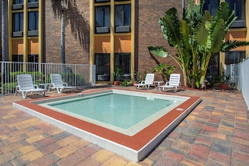 Outdoor pool, sun loungers at Comfort Inn & Suites Kissimmee by the Parks