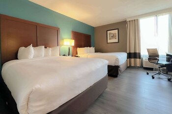 Family Room, Non Smoking (2 Queen Beds & 1 Bunk Bed) | Pillowtop beds, in-room safe, desk, laptop workspace at Comfort Inn & Suites Kissimmee by the Parks