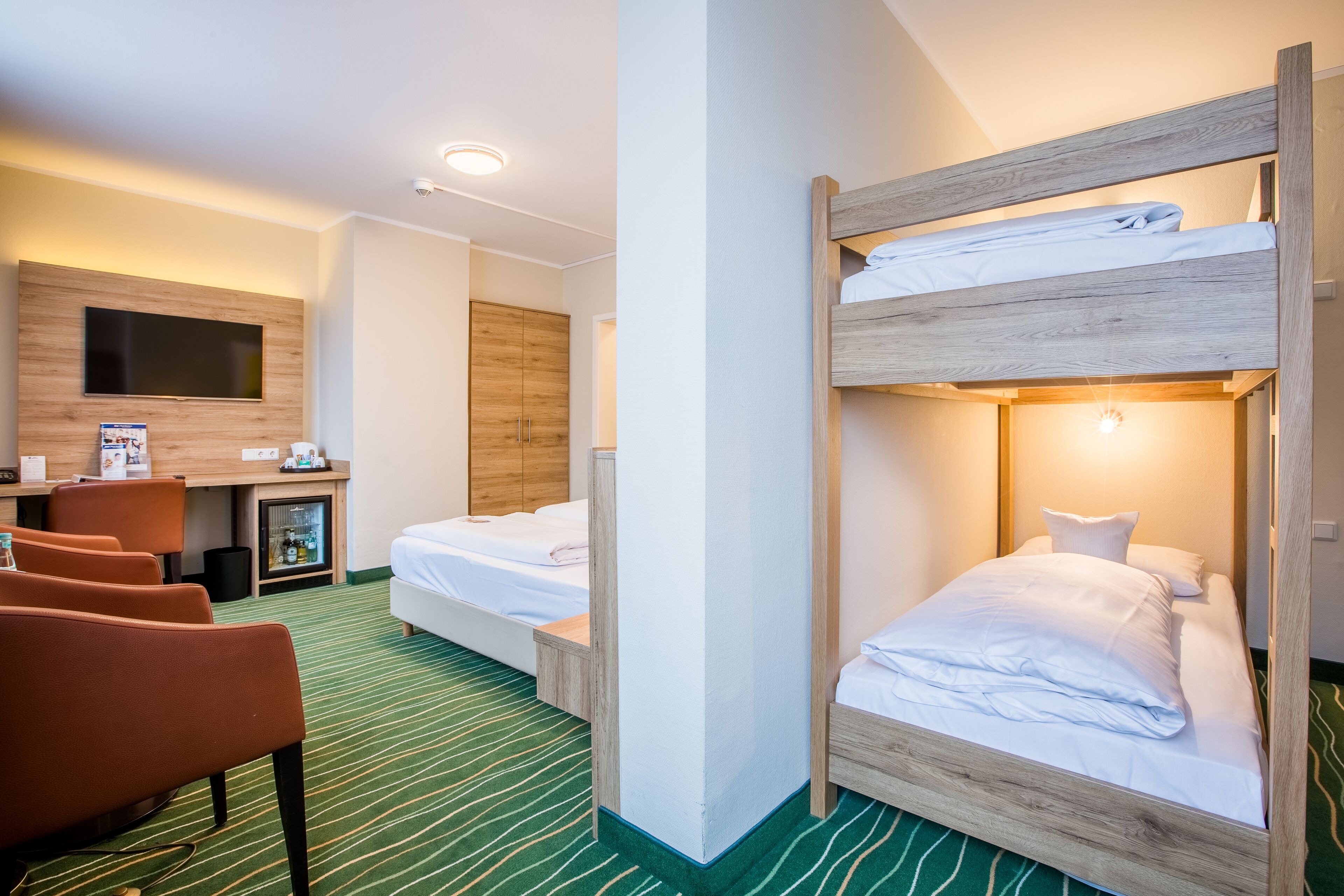 family quadruple room, multiple beds, garden view (cozy sitting corner;bunk beds) | 1 bedroom, hypo-allergenic bedding, desk, laptop workspace