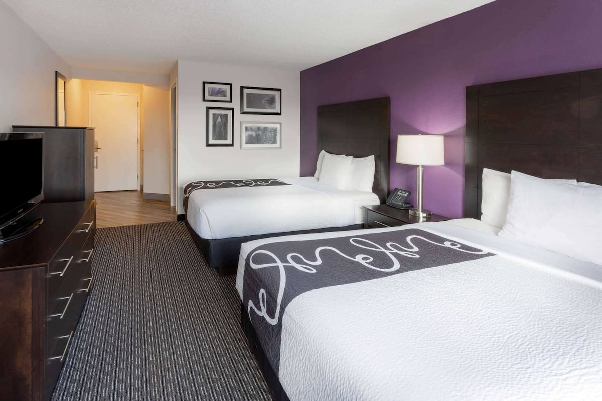 Premium bedding, pillow-top beds, desk, laptop workspace
