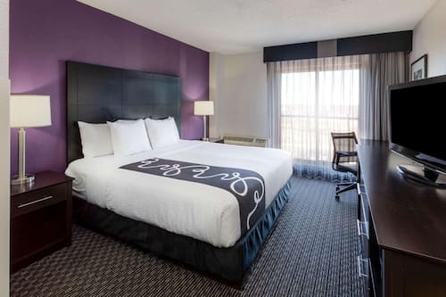 Premium bedding, pillow-top beds, desk, laptop workspace