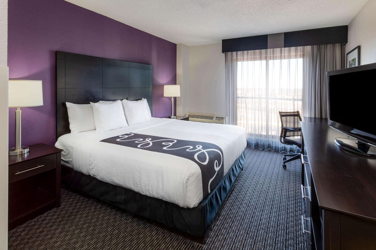 Premium bedding, pillow-top beds, desk, laptop workspace
