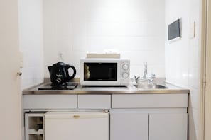 Mini-fridge, microwave, stovetop, coffee/tea maker