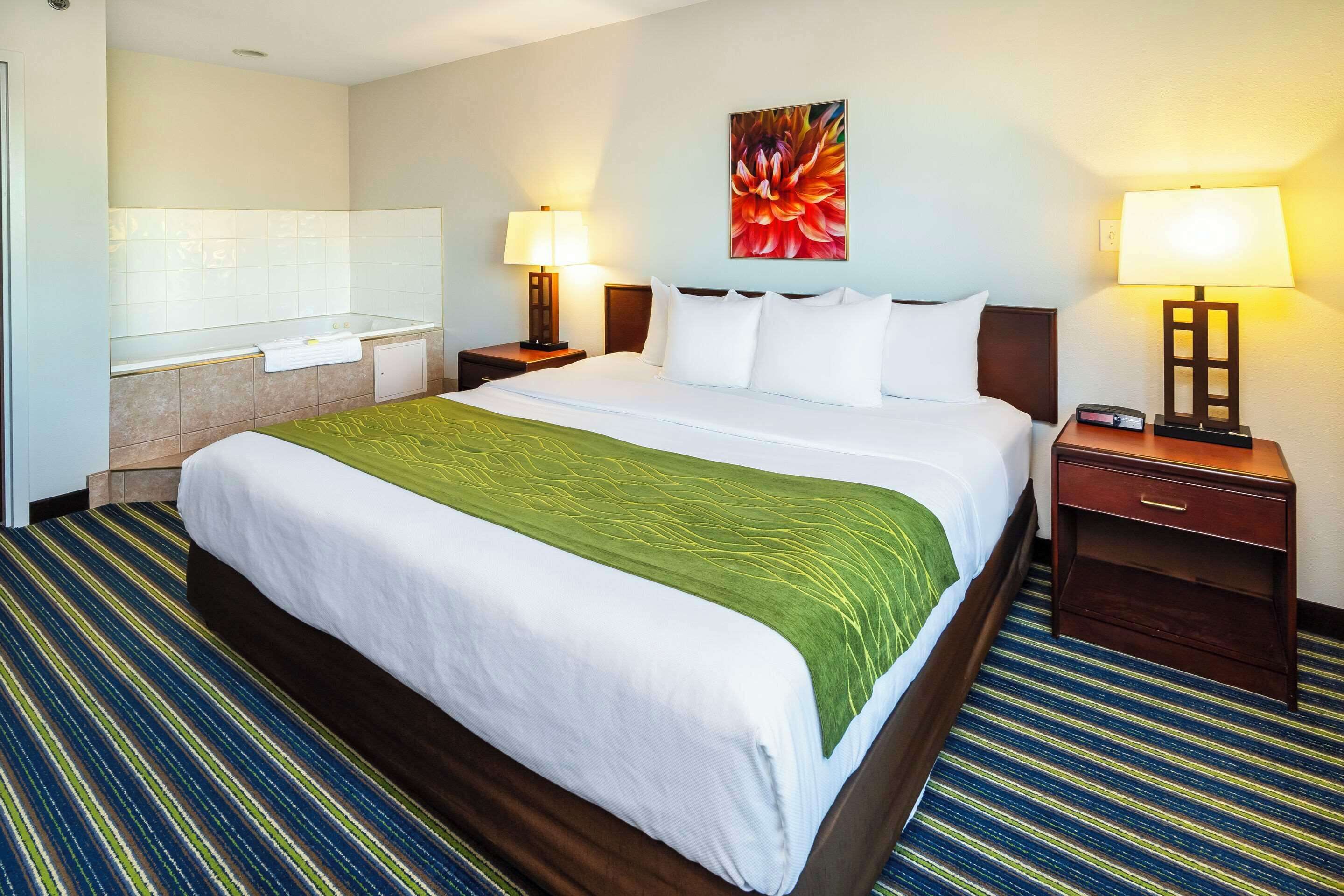 desk, laptop workspace, blackout curtains, iron/ironing board