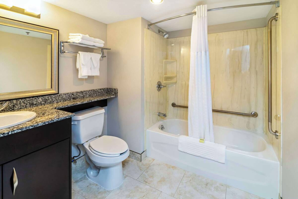 suite, 1 king bed with sofa bed, non smoking | desk, laptop workspace, blackout curtains, iron/ironing board