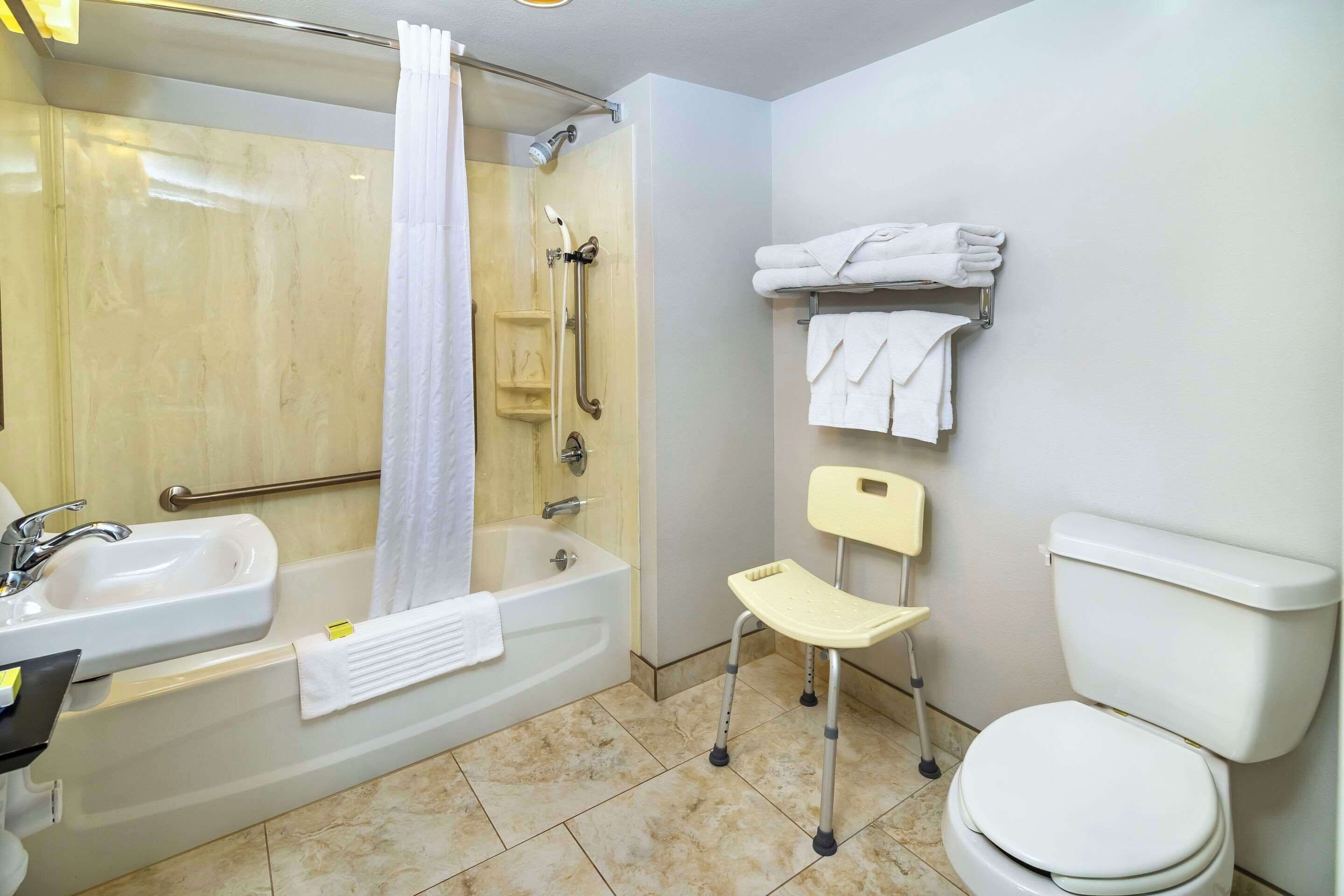 desk, laptop workspace, blackout curtains, iron/ironing board