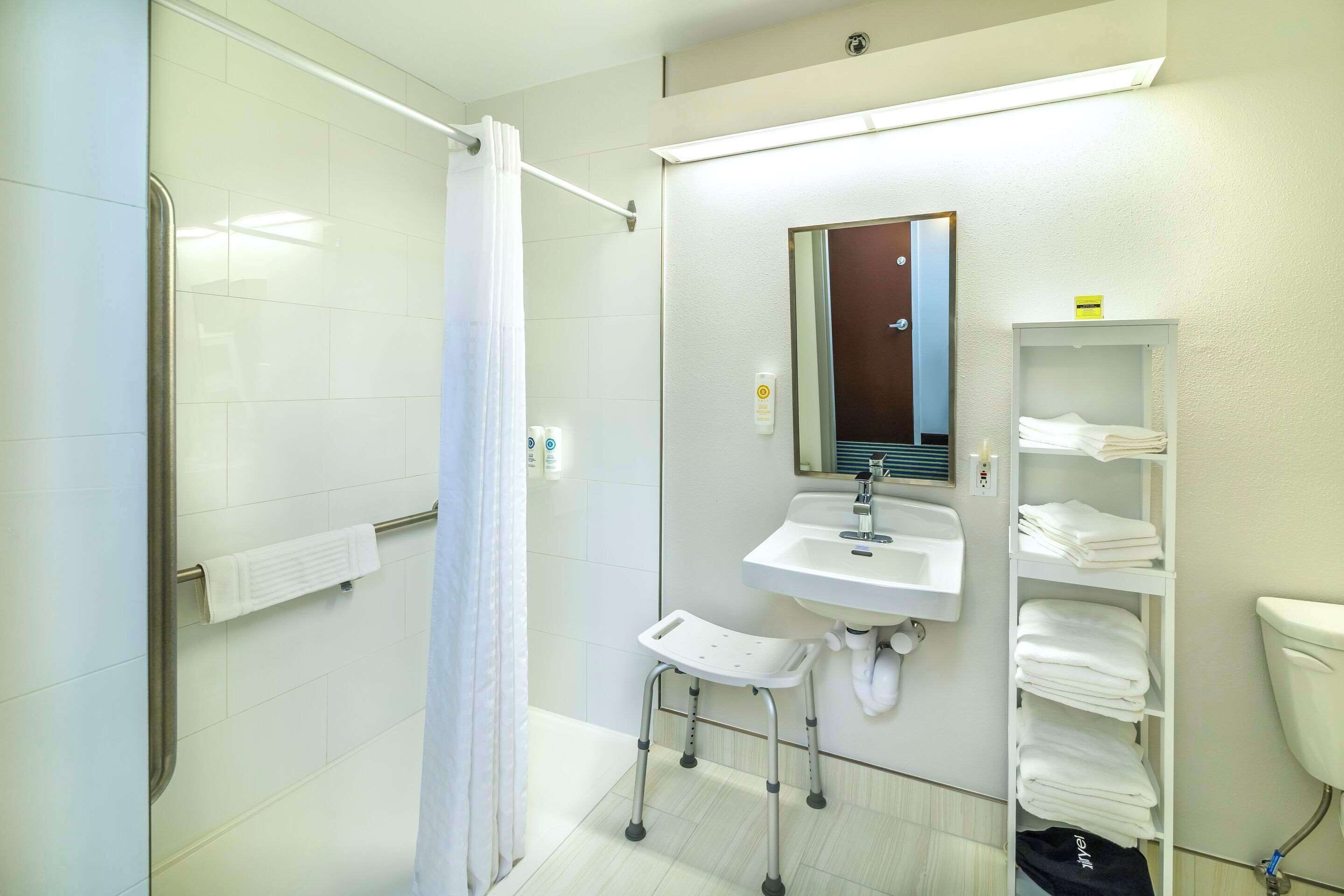 desk, laptop workspace, blackout curtains, iron/ironing board