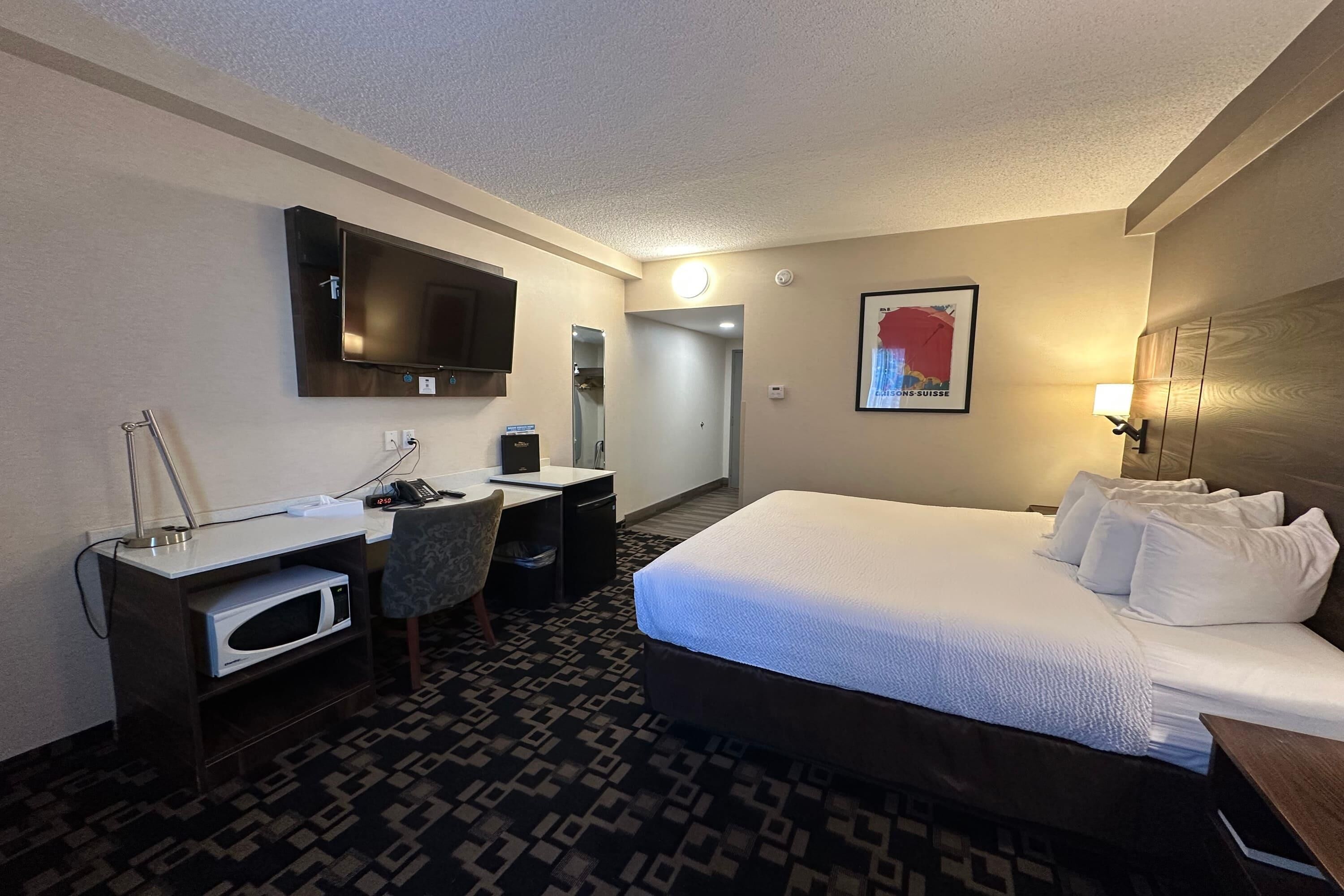 Room, 1 King Bed, Non Smoking | Pillow-top beds, individually decorated, desk, blackout curtains