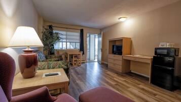 Suite, 1 King Bed, Refrigerator & Microwave | Pillowtop beds, blackout drapes, iron/ironing board, free WiFi