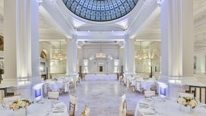 A grand banquet hall with white tables and chairs, a central stage, and a large, ornate ceiling. - ANDAZ LONDON LIVERPOOL STREET, BY HYATT (London)