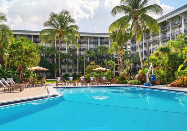 Outdoor pool, open 7:00 AM to 10:00 PM, pool umbrellas, sun loungers