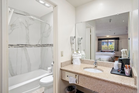 Combined shower/bathtub, eco-friendly toiletries, hair dryer, towels. Downtown SLO Inn - San Luis Obispo