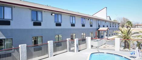 Seasonal outdoor pool, pool umbrellas, pool loungers