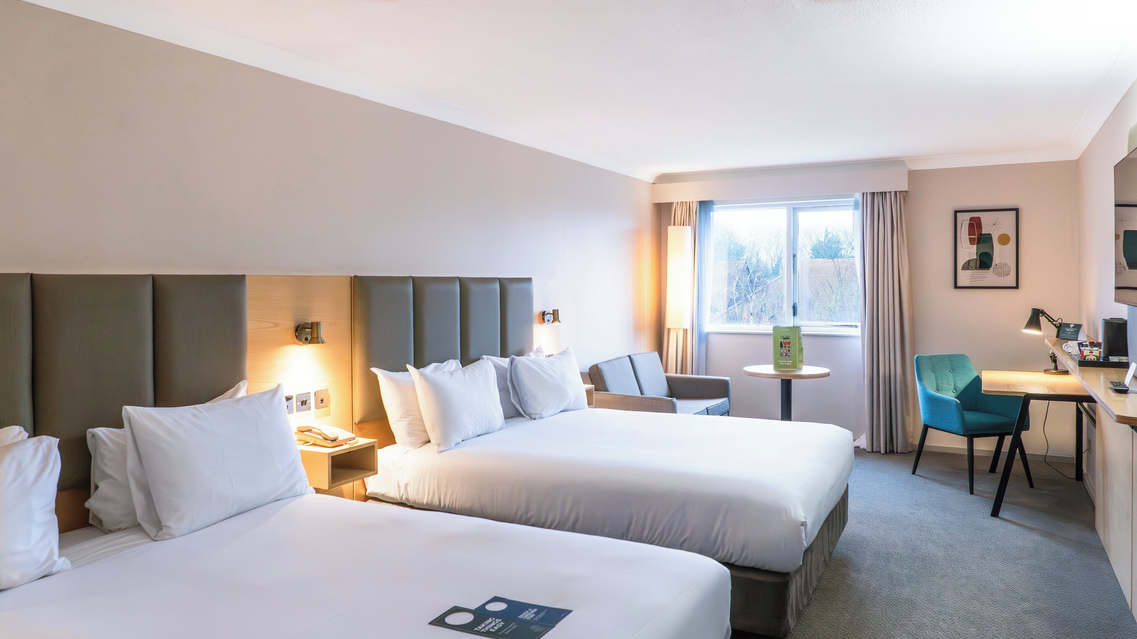 Hypo-allergenic bedding, desk, laptop workspace, blackout curtains