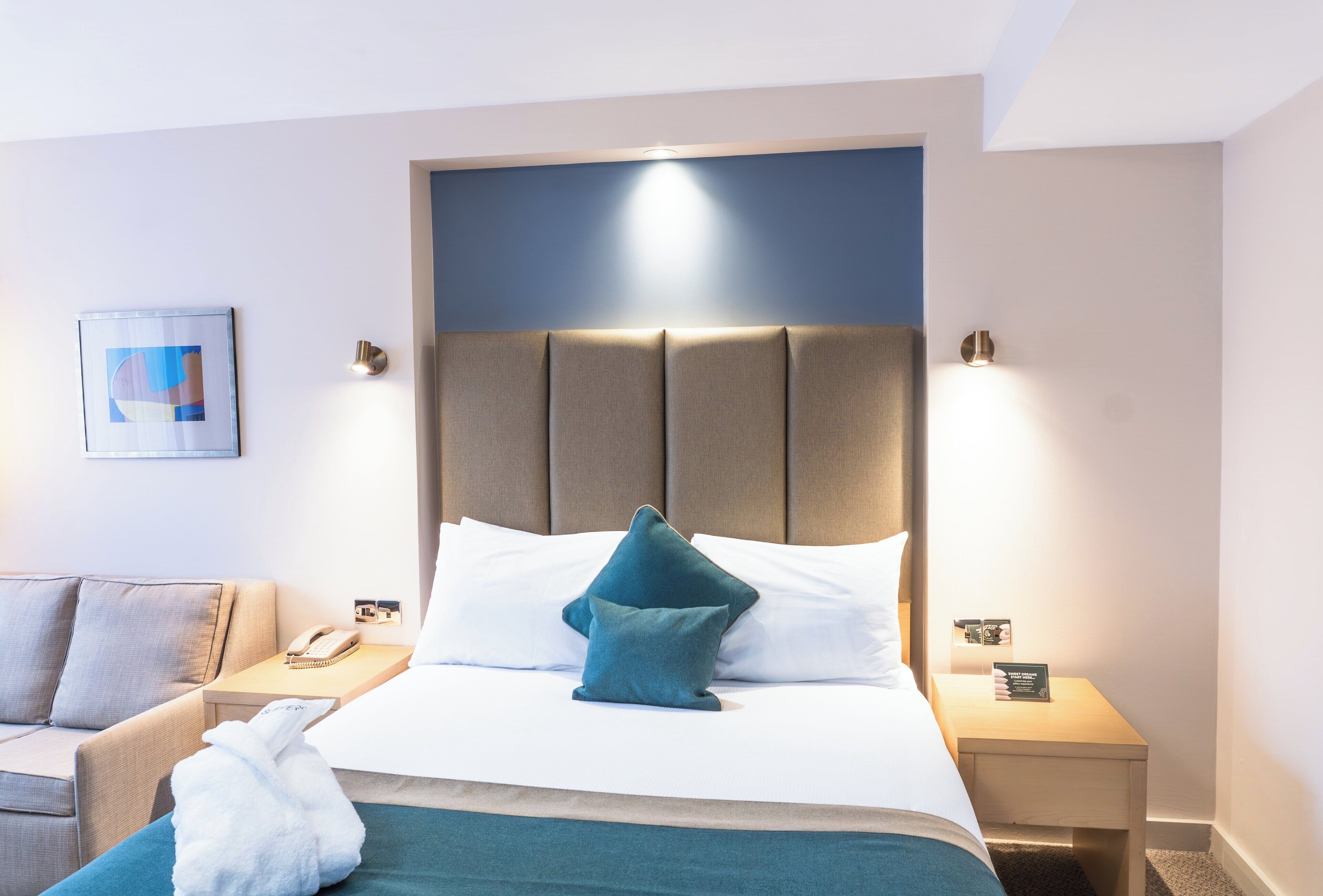 Hypo-allergenic bedding, desk, laptop workspace, blackout curtains