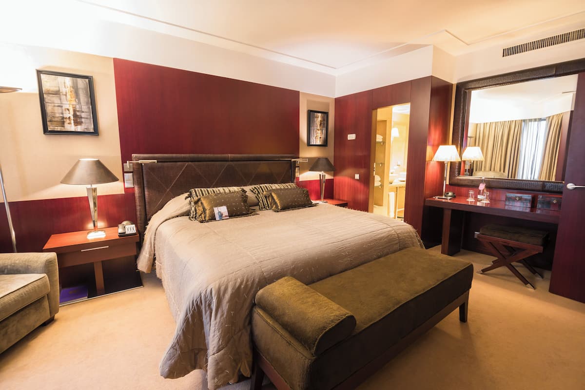 Suite presidencial | Ropa de cama de alta calidad y minibar