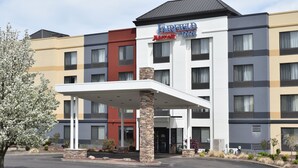 A Fairfield Inn & Suites hotel with a modern design, featuring a covered entrance and a landscaped driveway. - Fairfield Inn by Marriott Binghamton (Binghamton)