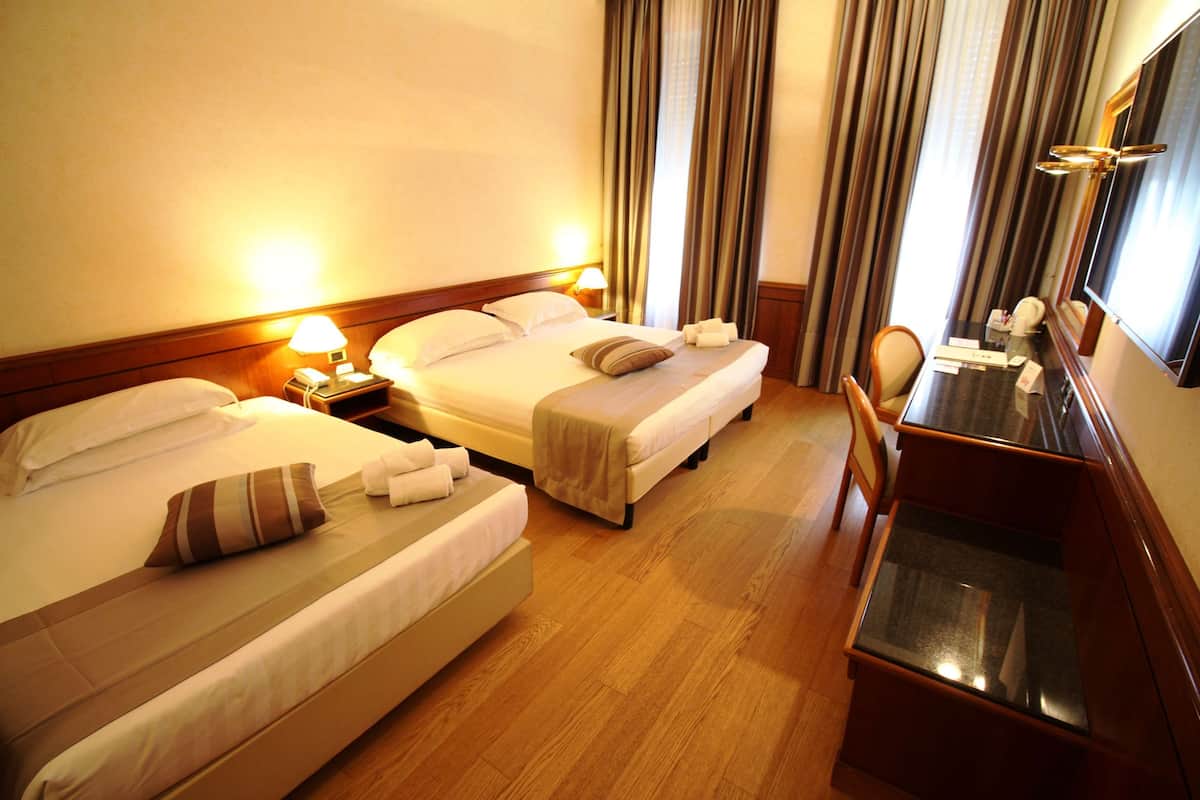 Standard Triple Room, Multiple Beds | Minibar, in-room safe, desk, laptop workspace