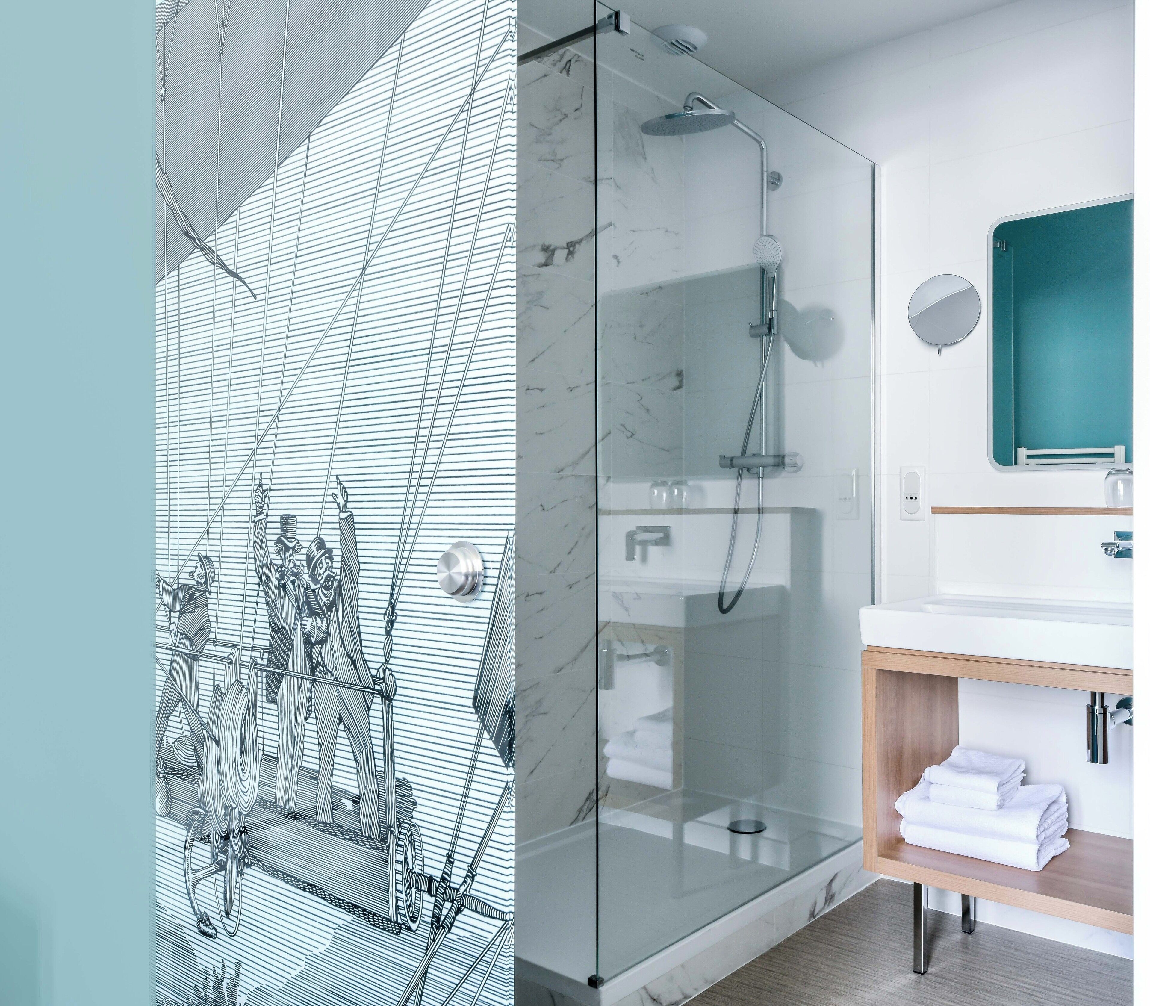 junior suite | bathroom | shower, rainfall showerhead, free toiletries, hair dryer