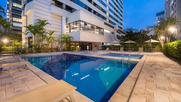 Outdoor pool, open 6:00 AM to 10:00 PM, pool loungers