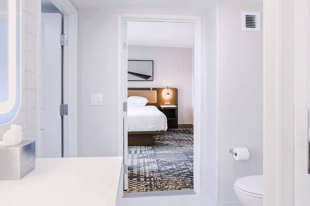 Suite, 1 King Bed, Non Smoking | Desk, blackout drapes, iron/ironing board, free WiFi