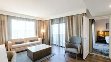 Suite, 1 King Bed, Non Smoking | Living area | 55-inch flat-screen TV with cable channels, TV